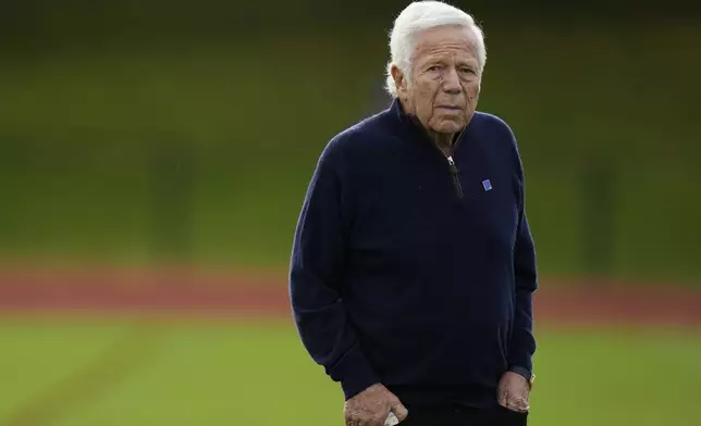 New England Patriots owner Robert Kraft walks on the field during NFL football practice, Friday, Oct. 18, 2024, in Harrow, England. (AP Photo/Steve Luciano)