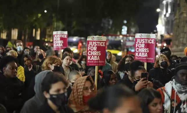 People demonstrate outside the Old Bailey in central London, Monday Oct. 21, 2024, after the London police officer who fatally shot Chris Kaba was acquitted of murder. (Jordan Pettitt/PA via AP)