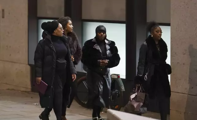 Friends and family members of Chris Kaba leave the Old Bailey in central London, Monday Oct. 21, 2024, after the London police officer who fatally shot Kaba was acquitted of murder. (Jordan Pettitt/PA via AP)