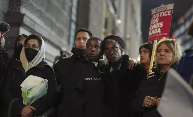 People demonstrate outside the Old Bailey in central London, Monday Oct. 21, 2024, after the London police officer who fatally shot Chris Kaba was acquitted of murder. (Jordan Pettitt/PA via AP)