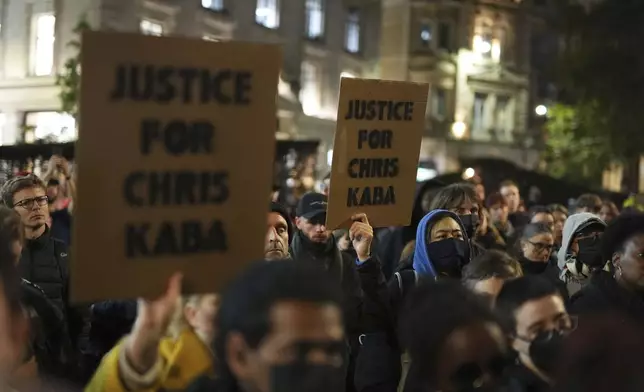 People demonstrate outside the Old Bailey in central London, Monday Oct. 21, 2024, after the London police officer who fatally shot Chris Kaba was acquitted of murder. (Jordan Pettitt/PA via AP)