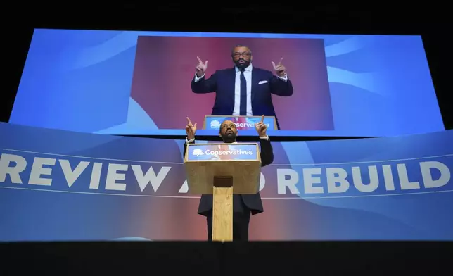 Conservative leadership candidate James Cleverly addresses members during the Conservative Party Conference at the International Convention Centre in Birmingham, England, Wednesday, Oct. 2, 2024.(AP Photo/Kin Cheung)