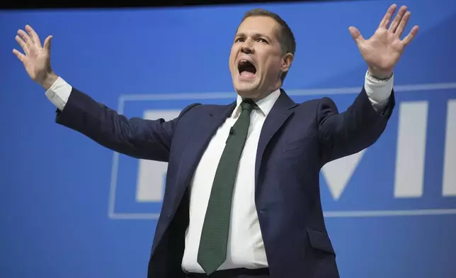 Conservative leadership candidate Robert Jenrick addresses members during the Conservative Party Conference at the International Convention Centre in Birmingham, England, Wednesday, Oct. 2, 2024.(AP Photo/Kin Cheung)