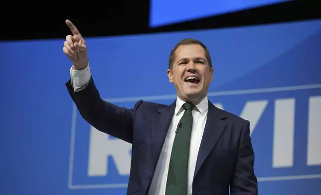 Conservative leadership candidate Robert Jenrick addresses members during the Conservative Party Conference at the International Convention Centre in Birmingham, England, Wednesday, Oct. 2, 2024.(AP Photo/Kin Cheung)