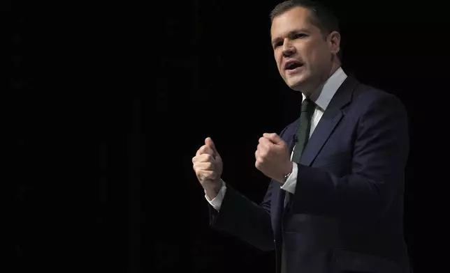 Conservative leadership candidate Robert Jenrick addresses members during the Conservative Party Conference at the International Convention Centre in Birmingham, England, Wednesday, Oct. 2, 2024.(AP Photo/Kin Cheung)