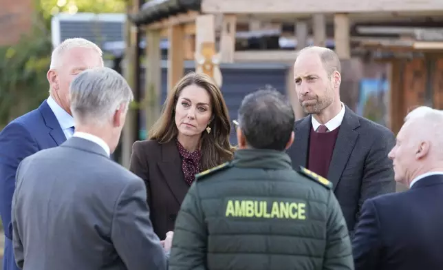 Britain's Prince William and Kate, Princess of Wales, meet members of the emergency services during a visit to Southport Community Centre to meet rescue workers and the families of those caught up in the Southport knife attack earlier this year in Southport, England, Thursday, Oct. 10, 2024. (Danny Lawson, Pool Photo via AP)