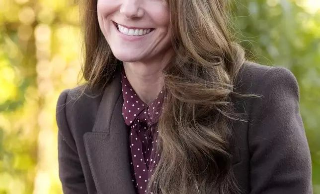 Britain's Kate, Princess of Wales, smiles as she meets rescue workers and the families of those caught up in the Southport knife attack earlier this year in Southport, England, Thursday, Oct. 10, 2024. (Danny Lawson, Pool Photo via AP)