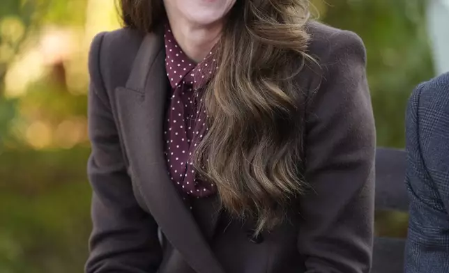 Britain's Kate, Princess of Wales, smiles as she meets rescue workers and the families of those caught up in the Southport knife attack earlier this year in Southport, England, Thursday, Oct. 10, 2024. (Danny Lawson, Pool Photo via AP)