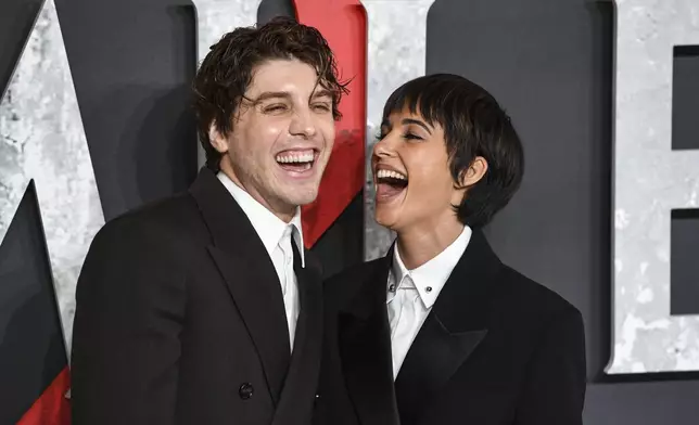 Lukas Gage, left, and Naomi Scott pose for photographers upon arrival at the premiere for the film 'Smile 2' on Tuesday, Oct. 8, 2024, in London. (Photo by Thomas Krych/Invision/AP)