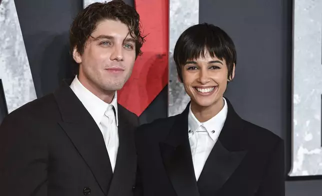 Lukas Gage, left, and Naomi Scott pose for photographers upon arrival at the premiere for the film 'Smile 2' on Tuesday, Oct. 8, 2024, in London. (Photo by Thomas Krych/Invision/AP)