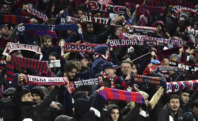 Bologna's fans hold banners at the end of the Champions League opening phase soccer match between Aston Villa and Bologna at the Villa Park in Birmingham, England, Tuesday, Oct. 22, 2024. (AP Photo/Rui Vieira)