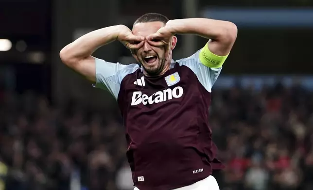 Aston Villa's John McGinn celebrates scoring their side's first goal of the game during the Champions League opening phase soccer match between Aston Villa and Bologna at the Villa Park in Birmingham, England, Tuesday, Oct. 22, 2024. (David Davies/PA via AP)