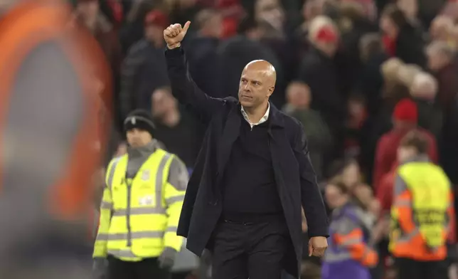 Liverpool's manager Arne Slot celebrates at the end of the Champions League soccer match between Liverpool and Bologna at the Anfield stadium in Liverpool, England, Wednesday, Oct. 2, 2024. (AP Photo/Ian Hodgson)