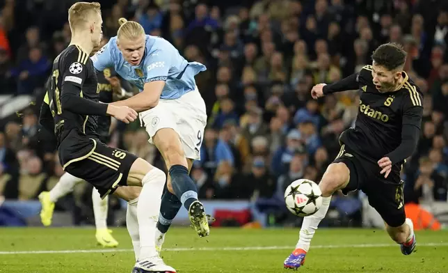 Manchester City's Erling Haaland scores his side's fourth goal during the Champions League opening phase soccer match between Manchester City and Sparta Praha at the Etihad Stadium in Manchester, England, Wednesday, Oct.23 , 2024. (AP Photo/Dave Thompson)