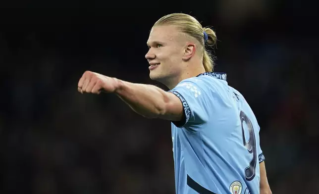 Manchester City's Erling Haaland celebrates after scoring his side's second goal during the Champions League opening phase soccer match between Manchester City and Sparta Praha at the Etihad Stadium in Manchester, England, Wednesday, Oct.23 , 2024. (AP Photo/Dave Thompson)