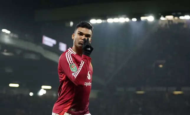 Manchester United's Casemiro celebrates after scoring his side's fourth goal during the English League Cup soccer match between Manchester United and Leicester City at the Old Trafford stadium in Manchester, England, Wednesday, Oct. 30, 2024. (AP Photo/Dave Thompson)