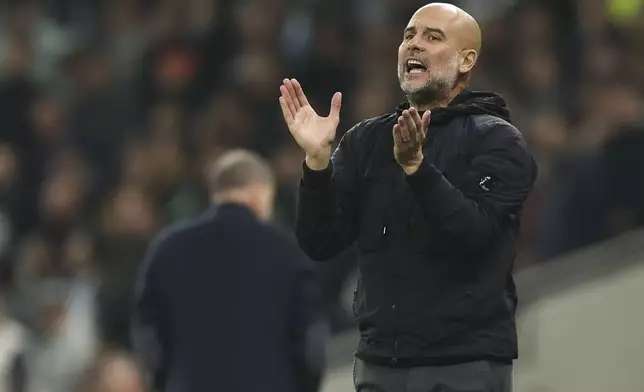 Manchester City's head coach Pep Guardiola reacts during the English League Cup fourth round soccer match between Tottenham and Manchester City, at the Tottenham Hotspur Stadium in London, Wednesday, Oct 30, 2024. (AP Photo/Ian Walton)