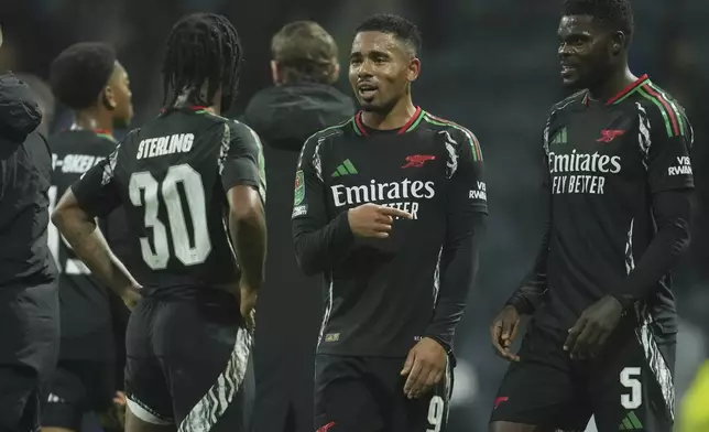 Arsenal's Gabriel Jesus, center, talks to his teammates after the English League Cup round of 16 soccer match between Preston and Arsenal at Deepdale, Preston, England, Wednesday Oct. 30, 2024. (AP Photo/Jon Super)