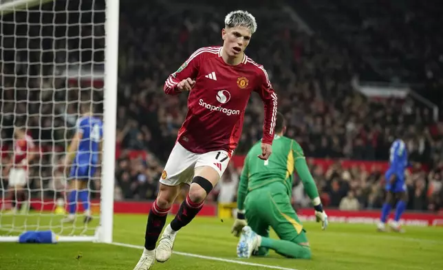 Manchester United's Alejandro Garnacho celebrates after scoring his side's second goal during the English League Cup soccer match between Manchester United and Leicester City at the Old Trafford stadium in Manchester, England, Wednesday, Oct. 30, 2024. (AP Photo/Dave Thompson)