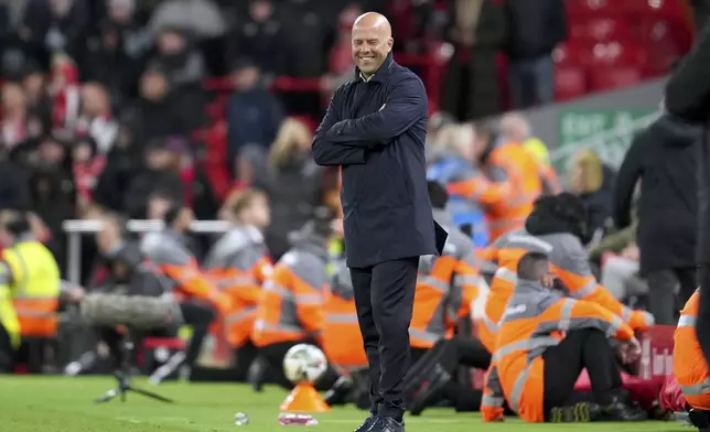 Liverpool's manager Arne Slot smiles after Cody Gakpo scored their fourth goal during the English League Cup soccer match between Liverpool and West Ham United at Anfield Stadium, Liverpool, England, Wednesday, Sept. 25, 2024. (AP Photo/Jon Super)