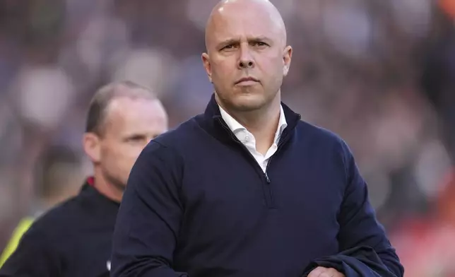 Liverpool's manager Arne Slot waits for the start of the English Premier League soccer match between Liverpool and Chelsea at Anfield Stadium, Liverpool, England, Sunday, Oct. 20, 2024. (AP Photo/Jon Super)