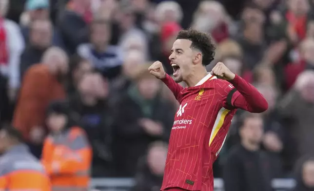 Liverpool's Curtis Jones celebrates after scoring his side's second goal during the English Premier League soccer match between Liverpool and Chelsea at Anfield Stadium, Liverpool, England, Sunday, Oct. 20, 2024. (AP Photo/Jon Super)