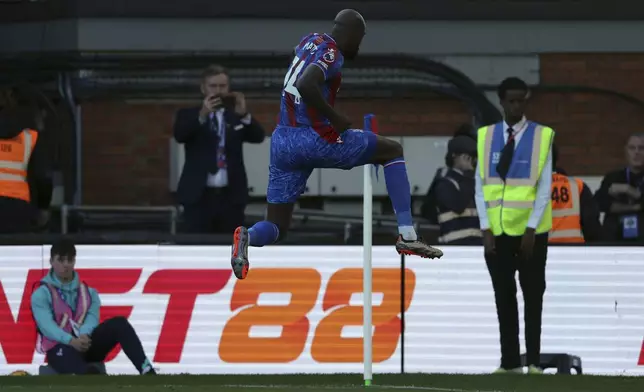 Crystal Palace's Jean-Philippe Mateta celebrates scoring the opening goal during the English Premier League soccer match between Crystal Palace and Tottenham Hotspur at Selhurst Park in London, Sunday, Oct. 27, 2024. (Steven Paston/PA via AP)