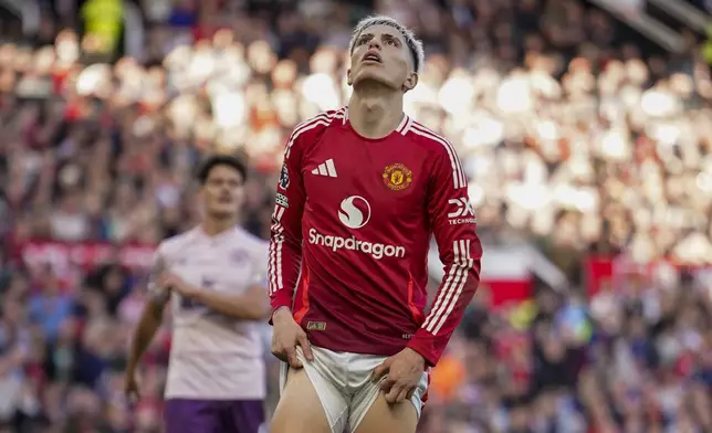 Manchester United's Alejandro Garnacho reacts after missing a chance to score during the English Premier League soccer match between Manchester United and Brentford at Old Trafford stadium in Manchester, England, Saturday, Oct. 19, 2024. (AP Photo/Dave Thompson)