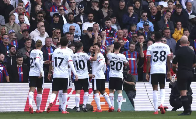 Liverpool's Diogo Jota, second from right, celebrates with teammatesafter scoring the opening goal during the English Premier League soccer match between Crystal Palace and Liverpool at Selhurst Park in London, Saturday, Oct. 5, 2024.(AP Photo/Ian Walton)