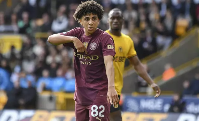 Manchester City's Rico Lewis gestures during the English Premier League soccer match between Wolverhampton Wanderers and Manchester City at the Molineux Stadium in Wolverhampton, England, Sunday, Oct. 20, 2024. (AP Photo/Rui Vieira)