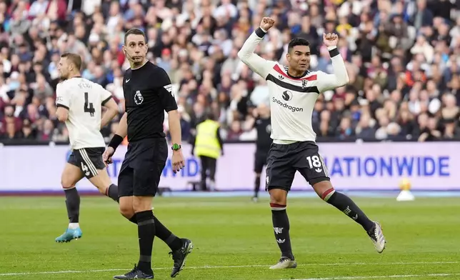 Manchester United's Casemiro celebrates scoring his side's first goal during the English Premier League soccer match between West Ham United and Manchester United at the London Stadium in London, Sunday, Oct. 27, 2024. (Nick Potts/PA via AP)