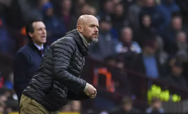 Manchester United's head coach Erik ten Hag, front, and Aston Villa's head coach Unai Emery react during the English Premier League soccer match between Aston Villa and Manchester United, at Villa Park in Birmingham, England, Sunday, Oct. 6, 2024. (AP Photo/Rui Vieira)