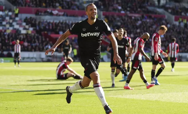 West Ham United's Tomas Soucek celebrates scoring his side's first goal of the game during the British Premier League soccer match between West Ham and Brentford, at the Gtech Community Stadium, London, Saturday Sept. 28, 2024. (John Walton/PA via AP)