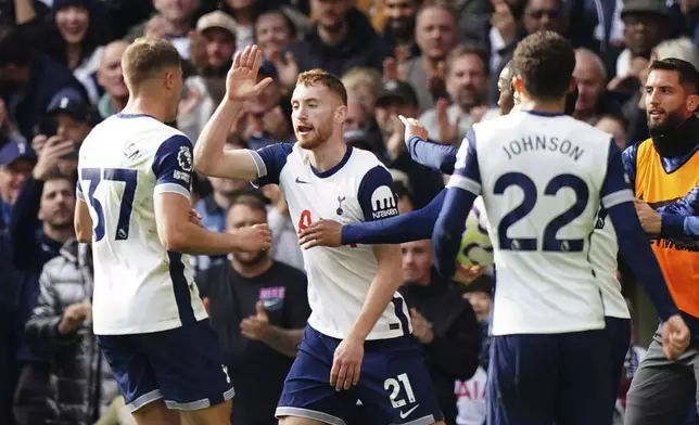 Tottenham Hotspur's Dejan Kulusevski, center, celebrates scoring with teammates during the English Premier League soccer match between Tottenham Hotspur and West Ham United at the Tottenham Hotspur Stadium, London, Saturday Oct. 19, 2024. (Zac Goodwin/PA via AP)