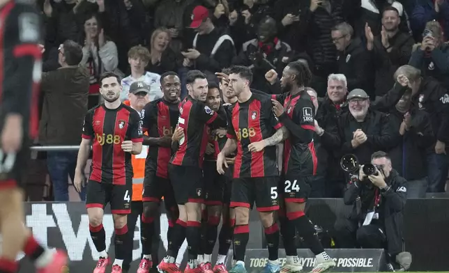 AFC Bournemouth players celebrate after Bournemouth's Justin Kluivert scored his side's second goal during the English Premier League soccer match between Bournemouth and Arsenal at the Vitality Stadium in Bournemouth, England, Saturday, Oct. 19, 2024. (AP Photo/Kin Cheung)