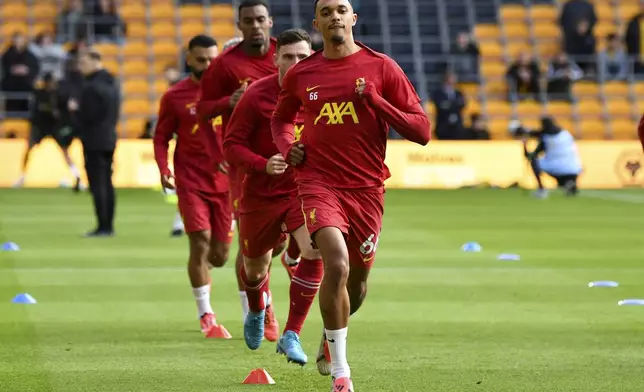 Liverpool's Trent Alexander-Arnold warms up prior to the English Premier League soccer match between Wolverhampton Wanderers and Liverpool at the Molineux Stadium in Wolverhampton, England, Saturday, Sept. 28, 2024. (AP Photo/Rui Vieira)