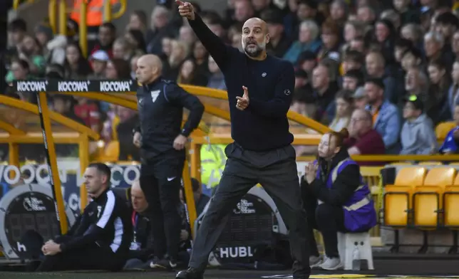 Manchester City's head coach Pep Guardiola gestures during the English Premier League soccer match between Wolverhampton Wanderers and Manchester City at the Molineux Stadium in Wolverhampton, England, Sunday, Oct. 20, 2024. (AP Photo/Rui Vieira)