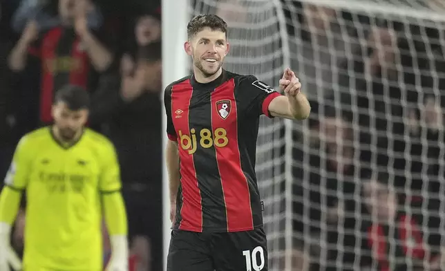 Bournemouth's Ryan Christie celebrates after scoring his side's opening goal during the English Premier League soccer match between Bournemouth and Arsenal at the Vitality Stadium in Bournemouth, England, Saturday, Oct. 19, 2024. (AP Photo/Kin Cheung)