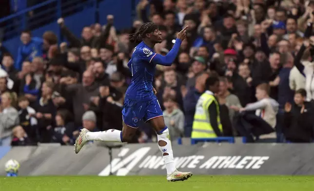 Chelsea's Noni Madueke celebrates scoring their side's first goal of the game during the English Premier League soccer match between Chelsea and Nottingham Forest at Stamford Bridge in London, Sunday Oct. 6, 2024. (Bradley Collyer/PA via AP)