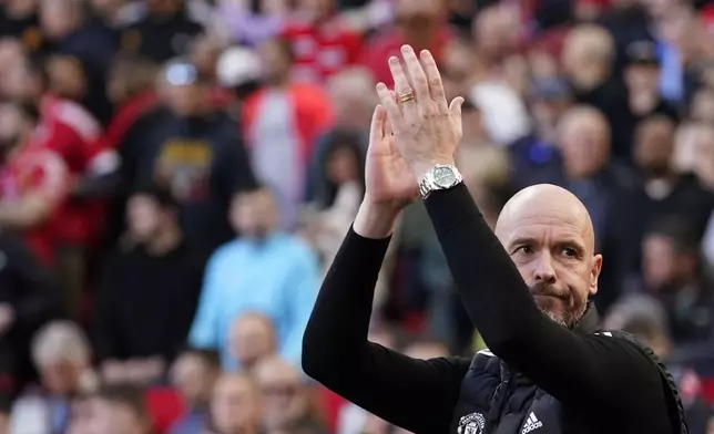 Manchester United's head coach Erik ten Hag applauds to supporters before the English Premier League soccer match between Manchester United and Brentford at Old Trafford stadium in Manchester, England, Saturday, Oct. 19, 2024. (AP Photo/Dave Thompson)