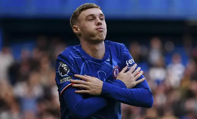 Chelsea's Cole Palmer celebrates after scoring his side's second goal during the English Premier League soccer match between Chelsea and Newcastle at Stamford Bridge in London, Sunday, Oct. 27, 2024. (AP Photo/Dave Shopland)