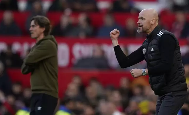 Manchester United's head coach Erik ten Hag, right, and Brentford's head coach Thomas Frank react during the English Premier League soccer match between Manchester United and Brentford at Old Trafford stadium in Manchester, England, Saturday, Oct. 19, 2024. (AP Photo/Dave Thompson)