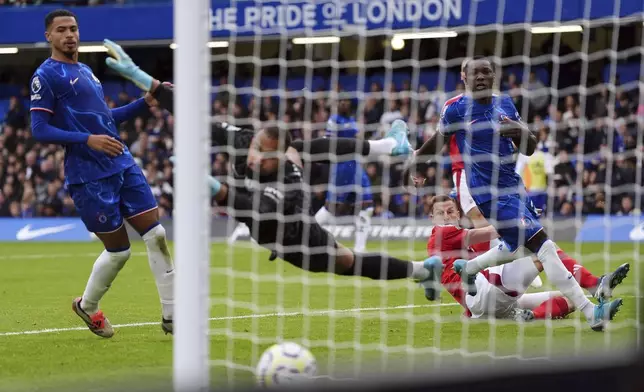 Nottingham Forest's Chris Wood scores their side's first goal of the game during the English Premier League soccer match between Chelsea and Nottingham Forest at Stamford Bridge in London, Sunday Oct. 6, 2024. (Bradley Collyer/PA via AP)