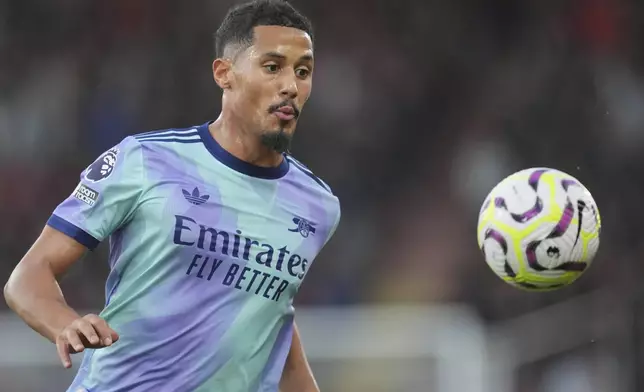 Arsenal's William Saliba in action during the English Premier League soccer match between Bournemouth and Arsenal at the Vitality Stadium in Bournemouth, England, Saturday, Oct. 19, 2024. (AP Photo/Kin Cheung)