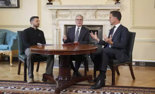 Britain's Prime Minister Keir Starmer, center, NATO Secretary General Mark Rutte, right, and Ukrainian President Volodymyr Zelenskyy meet inside 10 Downing Street in London, Thursday, Oct. 10, 2024.(AP Photo/Kin Cheung, Pool)