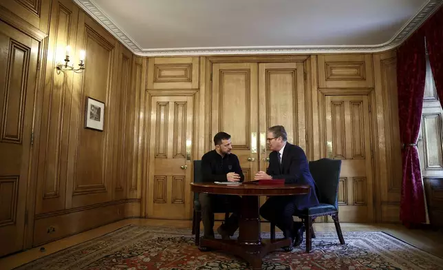 Britain's Prime Minister Keir Starmer, right, and Ukraine's President Volodymyr Zelenskyy speak during a bilateral meeting inside 10 Downing Street, in London, Thursday Oct. 10, 2024. (Henry Nicholls/Pool Photo via AP)