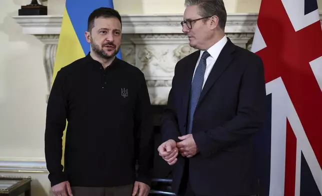 Britain's Prime Minister Keir Starmer, right, and Ukraine's President Volodymyr Zelenskyy speak during a bilateral meeting inside 10 Downing Street, in London, Thursday Oct. 10, 2024. (Henry Nicholls/Pool Photo via AP)