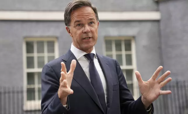 NATO Secretary General Mark Rutte speaks to the media after a meeting with Britain's Prime Minister Keir Starmer and Ukrainian President Volodymyr Zelenskyy at 10 Downing Street in London, Thursday, Oct. 10, 2024.(AP Photo/Kin Cheung)