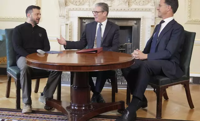 Britain's Prime Minister Keir Starmer, center, NATO Secretary General Mark Rutte, right, and Ukrainian President Volodymyr Zelenskyy meet inside 10 Downing Street in London, Thursday, Oct. 10, 2024.(AP Photo/Kin Cheung, Pool)