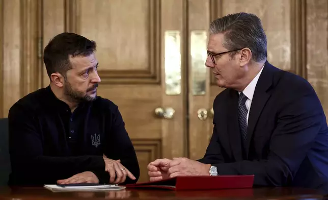 Britain's Prime Minister Keir Starmer, right, and Ukraine's President Volodymyr Zelenskyy speak during a bilateral meeting inside 10 Downing Street, in London, Thursday Oct. 10, 2024. (Henry Nicholls/Pool Photo via AP)